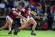 14 April 2002; Noel Morris of Tipperary in action against Fergal Healy of Galway during the Allianz National Hurling League Quarter-Final match between Galway and Tipperary at Semple Stadium in Thurles, Tipperary. Photo by Brendan Moran/Sportsfile