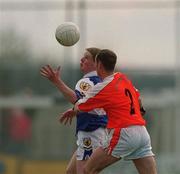 14 April 2002; Brian McDonald of Laois is tackled by Kevin McElvanna of Armagh during the Allianz National Football League Division 2 Semi-Final match between Armagh and Laois at Pearse Park in Longford. Photo by Ray McManus/Sportsfile