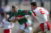 14 April 2002; Stephen Carolan of Mayo in action against Ciarán Gourley of Tyrone during the Allianz National Football League Division 1 Semi-Final match between Mayo and Tyrone at Brewster Park in Enniskillen, Fermanagh. Photo by Damien Eagers/Sportsfile