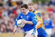 14 April 2002; Larry Reilly of Cavan in action against Ian Daly of Roscommon during the Allianz National Football League Semi-Final match between Cavan and Roscommon at Cusack Park in Mullingar, Westmeath. Photo by Aoife Rice/Sportsfile
