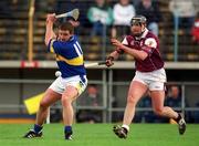 14 April 2002; John Carroll of Tipperary in action against Joe Rabbitte of Galway during the Allianz National Hurling League Quarter-Final match between Galway and Tipperary at Semple Stadium in Thurles, Tipperary. Photo by Brendan Moran/Sportsfile
