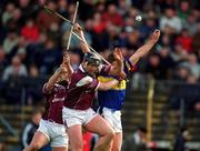 14 April 2002; Noel Morris of Tipperary in action against Joe Rabbitte and Fergal Healy, left, of Galway during the Allianz National Hurling League Quarter-Final match between Galway and Tipperary at Semple Stadium in Thurles, Tipperary. Photo by Brendan Moran/Sportsfile