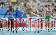 2 September 2011; Derval O'Rourke, Ireland, clears the final hurdle during her heat of the Women's 100m Hurdle event, where she finished in second position in a time of 13.07 and qualified for the Semi-Final. Also pictured are Heat winner Sally Pearson, Australia, right, and Lavonne Idlette, Dominican Republic. IAAF World Championships - Day 7, Daegu Stadium, Daegu, Korea. Picture credit: Stephen McCarthy / SPORTSFILE