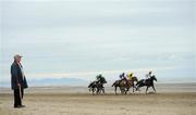 8 September 2011; Dermot McCarthy, from Drogheda, Co. Louth, watches the runners and riders during the Hibernia Steel Race. Laytown Strand Races, Laytown Strand, Laytown, Co. Meath. Picture credit: Brian Lawless / SPORTSFILE