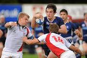 10 September 2011; Thomas Daly, Leinster, is tackled by David Scott and Jonny McLaughlin, right, Ulster. Sword Security Under 19 Blue Interprovincial, Ulster v Leinster, Dungannon RFC, Dungannon, Co. Tyrone. Picture credit: Oliver McVeigh / SPORTSFILE