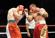 10 September 2011; Eamon O'Kane, right, exchanges punches with Joe Rea during their Middleweight bout. WBA World Light-Welterweight Championship Eliminator, Undercard, Eamon O'Kane v Joe Rea, Odyssey Arena, Belfast, Co. Antrim. Picture credit: Oliver McVeigh / SPORTSFILE