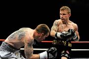 10 September 2011; Carl Frampton, right, exchanges punches with Mark Quon during their vacant Commonwealth Super Bantamweight bout. WBA World Light-Welterweight Championship Eliminator, Undercard, Carl Frampton v Mark Quon, Odyssey Arena, Belfast, Co. Antrim. Picture credit: Oliver McVeigh / SPORTSFILE