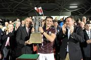 10 September 2011; Galway captain Barry Daly is presented with the trophy by Uachtarán CLG Criostóir Ó Cuana and John Mullins, CEO Bord Gais, right. Bord Gais Energy GAA Hurling Under 21 All-Ireland 'A' Championship Final, Galway v Dublin, Semple Stadium, Thurles, Co. Tipperary. Picture credit: Ray McManus / SPORTSFILE
