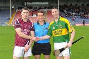 10 September 2011; The Westmeath captain, Alan McGrath, left, and the Kerry captain, Jason Bowler, shake hands accross referee Colm Lyons before the game. Bord Gais Energy GAA Hurling Under 21 All-Ireland 'B' Championship Final, Kerry v Westmeath, Semple Stadium, Thurles, Co. Tipperary. Picture credit: Ray McManus / SPORTSFILE