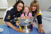 12 September 2011; Ellie Cole, aged 6, from Dublin, with Wexford players Ursula Jacob, left, Deirdre Codd and the O'Duffy Cup, at Our Lady's Hospital for Sick Children, Crumlin, Dublin. Picture credit: Pat Murphy / SPORTSFILEE