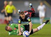 12 September 2011; Aidan Downes, Bohemians, is tackled by Dundalk goalkeeper Peter Cherrie. Airtricity League Premier Division, Bohemians v Dundalk, Dalymount Park, Dublin. Photo by Sportsfile