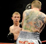 10 September 2011; Carl Frampton, left, exchanges punches with Mark Quon during their vacant Commonwealth Super Bantamweight bout. WBA World Light-Welterweight Championship Eliminator, Undercard, Carl Frampton v Mark Quon, Odyssey Arena, Belfast, Co. Antrim. Picture credit: Oliver McVeigh / SPORTSFILE