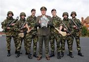 14 September 2011; Defence Forces Chief of Staff Lieutenant General Seán McCann holds the Liam MacCarthy cup alongside Kilkenny's All-Ireland medal winners Private Eoin Larkin, left, and Private Paul Murphy, right, and troops from the 2nd Field Artillary Regiment at McKee Barracks. McKee Barracks, Blackhorse Avenue, Dublin. Picture credit: Barry Cregg / SPORTSFILE