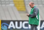 16 September 2011; Ireland head coach Declan Kidney takes notes during the Ireland Squad Captain's Run ahead of their 2011 Rugby World Cup, Pool C, game against Australia on Saturday. Ireland Rugby Squad Press Conference, Eden Park, Auckland, New Zealand. Picture credit: Brendan Moran / SPORTSFILE