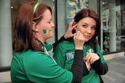 17 September 2011; Ireland supporter Nicola McClenaghan, from Belfast, Co. Antrim, has her face painted by Emily Kenny, from Clonmel, Co. Tipperary, in Auckland before the game. 2011 Rugby World Cup, Pool C, Australia v Ireland, Eden Park, Auckland, New Zealand. Picture credit: Brendan Moran / SPORTSFILE