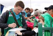 18 September 2011; Ireland captain Brian O'Driscoll signs his autograph for a young fan. Taupo, New Zealand. Picture credit: Peter Graney / SPORTSFILE