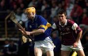 14 April 2002; Lar Corbett of Tipperary is tackled by Richie Murray of Galway during the Allianz National Hurling League Quarter-Final match between Galway and Tipperary at Semple Stadium in Thurles, Tipperary. Photo by Brian Lawless/Sportsfile