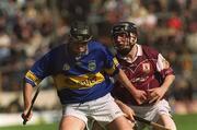 14 April 2002; Eddie Enright of Tipperary is tackled by Francis Forde of Galway during the Allianz National Hurling League Quarter-Final match between Galway and Tipperary at Semple Stadium in Thurles, Tipperary. Photo by Brian Lawless/Sportsfile