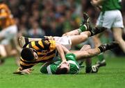 21 April 2002; Philip Larkin of Kilkenny tussles with Donie Ryan of Limerick during the Allianz National Hurling League Semi-Final match between Kilkenny and Limerick at Gaelic Grounds in Limerick. Photo by Damien Eagers/Sportsfile