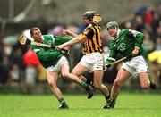 21 April 2002; JJ Delaney of Kilkenny is tackled by Ciarán Carey, left, and Mick O'Brien of Limerick during the Allianz National Hurling League Semi-Final match between Kilkenny and Limerick at Gaelic Grounds in Limerick. Photo by Damien Eagers/Sportsfile