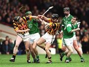 21 April 2002; Peter Barry, left, and JJ Delaney of Kilkenny in action against Sean O'Connor, left, and Donie Ryan of Kilkenny during the Allianz National Hurling League Semi-Final match between Kilkenny and Limerick at Gaelic Grounds in Limerick. Photo by Damien Eagers/Sportsfile