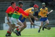 14 April 2002; Mickey Cunniffe of Rosommon in action against Willie Hickey, 22, and team-mate Johnny Nevin of Carlow