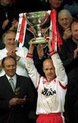 28 April 2002; Tyrone captain Peter Canavan lifts the cup after the Allianz National Football League Division 1 Final match between Tyrone and Cavan at St Tiernach's Park in Clones, Monaghan. Photo by Damien Eagers/Sportsfile