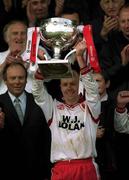 28 April 2002; Tyrone captain Peter Canavan lifts the cup prior to the Allianz National Football League Division 1 Final match between Tyrone and Cavan at St Tiernach's Park in Clones, Monaghan. Photo by Damien Eagers/Sportsfile