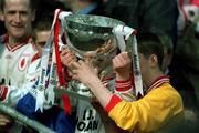 28 April 2002; Tyrone players celebrate with the cup after the Allianz National Football League Division 1 Final match between Tyrone and Cavan at St Tiernach's Park in Clones, Monaghan. Photo by Damien Eagers/Sportsfile