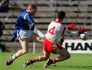 28 April 2002; Anthony Forde of Cavan in action against Brian Robinson of Tyrone during the Allianz National Football League Division 1 Final match between Tyrone and Cavan at St Tiernach's Park in Clones, Monaghan. Photo by Damien Eagers/Sportsfile