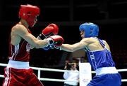 2 October 2011; Michael Conlan, St. John Bosco B.C., Belfast, Antrim, representing Ireland, right, exchanges punches with Olzhas Sattibayev, Kazakhstan, during their 52kg bout. Conlon won the bout 18-17 to advance to the Last 16. 2011 AIBA World Boxing Championships - Last 32, Michael Conlon v Olzhas Sattibayev. Heydar Aliyev Sports and Exhibition Complex, Baku, Azerbaijan. Picture credit: Stephen McCarthy / SPORTSFILE