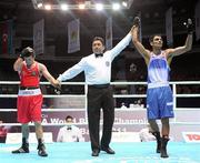 4 October 2011; Referee Jones Kennedy Silva, Brazil, raises the hand of Jai Bhagwan, India, following his 60kg victory over David Oliver Joyce, St Michael's Athy B.C., Kildare, representing Ireland. Joyce was defeated 32-30. 2011 AIBA World Boxing Championships - Last 16, David Oliver Joyce v Jai Bhagwan. Heydar Aliyev Sports and Exhibition Complex, Baku, Azerbaijan. Picture credit: Stephen McCarthy / SPORTSFILE