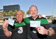 5 October 2011; Republic of Ireland supporters John and Phil Brennan, both from Dublin, holding their match tickets on their arrival at Barcelona Airport, ahead of their side's EURO 2012 Championship Qualifier against Andorra on Friday. Barcelona Airport, Barcelona, Spain. Picture credit: David Maher / SPORTSFILE