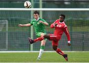 13 April 2017; James Carroll of Republic of Ireland in action against Kingsford Adjei of England during the Centenary Shield match between Republic of Ireland U18s and England at Home Farm FC in Whitehall, Dublin. Photo by Matt Browne/Sportsfile