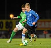 7 October 2011; Tarmo Kink, Estonia, in action against Chris Brunt, Northern Ireland. EURO 2012 Championship Qualifier, Northern Ireland v Estonia, Windsor Park, Belfast, Co. Antrim. Picture credit: Oliver McVeigh / SPORTSFILE