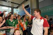 11 October 2011; Ireland's Brian O'Driscoll waves to supporters on the team's arrival back in Dublin Airport from the 2011 Rugby World Cup in New Zealand. Dublin Airport, Dublin. Picture credit: Pat Murphy / SPORTSFILE