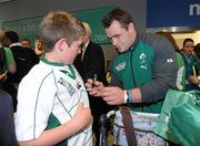 11 October 2011; Ireland's Cian Healy signs autographs on the team's arrival back in Dublin Airport from the 2011 Rugby World Cup in New Zealand. Dublin Airport, Dublin. Picture credit: Pat Murphy / SPORTSFILE
