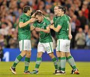 11 October 2011; Richard Dunne, Republic of Ireland, celebrates scoring his side's seond goal with team-mates Keith Andrews, Simon Cox and Sean St. Ledger. EURO 2012 Championship Qualifier, Republic of Ireland v Armenia, Aviva Stadium, Lansdowne Road, Dublin. Picture credit: David Maher / SPORTSFILE