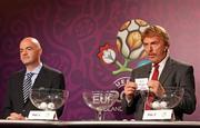 13 October 2011; UEFA EURO 2012 ambassador Zbigniew Boniek, right, alongside UEFA general secretary Gianni Infantino, draws out the name of the Republic of Ireland during the EURO 2012 Championship play-off draw. The Republic of Ireland will now play Estonia over two legs on the 11th and 15th of November. EURO 2012 Championship Play-Off Draw, The Sheraton Hotel, Krakow, Poland. Picture credit: Lukasz Grochala / SPORTSFILE