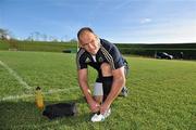 1 November 2011; Munster's BJ Botha ties his boot laces before squad training ahead of their Celtic League match against Leinster on Friday night. Munster Rugby Squad Training, University Limerick, Limerick. Picture credit: Diarmuid Greene / SPORTSFILE