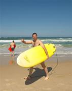 2 November 2011; Ireland's Joe McMahon sets out to try his hand at surfing during a visit to Surfers Paradise Beach as the players relax in advance of the 2nd International Rules Series 2011 Test.  Surfers Paradise, Gold Coast, Australia. Picture credit: Ray McManus / SPORTSFILE