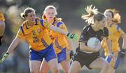 6 November 2011; Juliet Murphy, Donoughmore, Cork, in action against Mary Nevin, left, and Arlene Cushen, Na Fianna, Dublin. Tesco All-Ireland Senior Ladies Football Club Championship Semi-Final, Na Fianna, Dublin v Donoughmore, Cork, C.L.G. Na Fianna, Mobhi Road, Glasnevin, Co. Dublin. Picture credit: Brendan Moran / SPORTSFILE