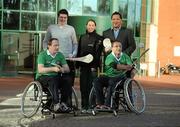 7 November 2011; At today's launch of the All-Ireland Wheelchair Hurling/Camogie blitz, Limerick Wheelchair athlete Thomas Byrnes, looks on as Pat Culhane, Munster GAA Hurling Development Administrator, demonstrates the solo. As part of European City of Sport, 2011; Limerick's rising star - Declan Hannon lends a hand to help promote the event which takes place in the Sports Arena, University of Limerick next Saturday, November 12th.  Pictured with Hannon, from right, Tony Watene, GAA National Inclusion Officer, and Rosemary Ryan, Sports Inclusion Disability Officer, Limerick City Sports Partnership. Launch 2011 All-Ireland Wheelchair Hurling/Camogie blitz - Univeristy of Limerick. Picture credit: Diarmuid Greene / SPORTSFILE