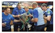21 May 2011; The coaches, Richie Murphy, Jono Gibbes, Joe Schmidt and Greg Feek, duck for cover as they’re about to be drenched during the celebrations. The book, which has an RRP of €24.95, is on sale from www.leinsterrugby.ie, www.sportsfile.com and from select bookshops nationwide. Picture credit: Brendan Moran / SPORTSFILE
