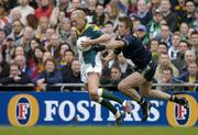 17 October 2004; Ciaran McDonald, Ireland, in action against Max Hudghton, Australia. Coca Cola International Rules Series 2004, First Test, Ireland v Australia, Croke Park, Dublin. Picture credit; Brendan Moran / SPORTSFILE *** Local Caption *** Any photograph taken by SPORTSFILE during, or in connection with, the 2004 Coca Cola International Rules Series which displays GAA logos or contains an image or part of an image of any GAA intellectual property, or, which contains images of a GAA player/players in their playing uniforms, may only be used for editorial and non-advertising purposes.  Use of photographs for advertising, as posters or for purchase separately is strictly prohibited unless prior written approval has been obtained from the Gaelic Athletic Association.