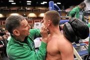 24 November 2011; Brian Brosnan, from Galway, receives attention from Irish team coach Michael McDermott after his victory over Yalcin Ornek, from Turkey, in their 71 kg full contact bout. 2011 WAKO World Kickboxing Championships, Citywest Conference Centre, Saggart, Dublin. Picture credit: Matt Browne / SPORTSFILE