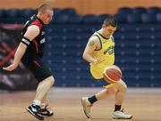 26 November 2011; Ciaran Rattigan, right, Navan Arch Club, Co. Meath, in action against Graeme Clark, left, Antrim Borough, Co. Antrim. 2011 Special Olympics Ireland National Basketball Cup - Men, Antrim Borough v Navan Arch Club, National Basketball Arena, Tallaght, Dublin. Picture credit: Barry Cregg / SPORTSFILE