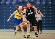 26 November 2011; Graeme Clark, right, Antrim Borough, Co. Antrim, in action against Fiacra Englishby, Navan Arch Club, Co. Meath. 2011 Special Olympics Ireland National Basketball Cup - Men, Antrim Borough v Navan Arch Club, National Basketball Arena, Tallaght, Dublin. Picture credit: Barry Cregg / SPORTSFILE