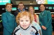 29 November 2011; Aer Lingus announces it will be the official airline partner of Dublin GAA in a three year sponsorship agreement. The GAA All Ireland Football Champions, their manager Pat Gilroy and families were in T2 today, Tuesday 29 November, preparing to fly out to Orlando, Florida, courtesy of Aer Lingus. Pictured is Jamie Brogan, age 2, son of Alan Brogan and his wife Lydia, second from right, with Aer Lingus staff Jamie-Leigh Arthurs, left, and Aine Behan. Dublin Airport, Dublin. Picture credit: Brian Lawless / SPORTSFILE