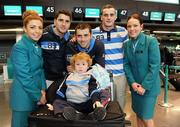 29 November 2011; Aer Lingus announces it will be the official airline partner of Dublin GAA in a three year sponsorship agreement. The GAA All Ireland Football Champions, their manager Pat Gilroy and families were in T2 today, Tuesday 29 November, preparing to fly out to Orlando, Florida, courtesy of Aer Lingus. Pictured are brothers Bernard, Alan and Paul Brogan with Alan's son Jamie Brogan, age 2, and Aer Lingus staff Jamie-Leigh Arthurs, left, and Aine Behan. Dublin Airport, Dublin. Picture credit: Brian Lawless / SPORTSFILE